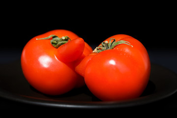kiss tomatoes on the black