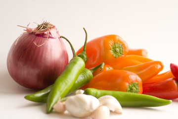 onions mini bell peppers, green chillies and garli