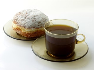 a cup of coffee and doughnut