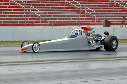 dragster heads down the track