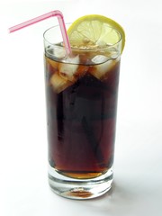 brown cooling drink with ice and lemon slice