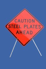 caution steel plates ahead sign