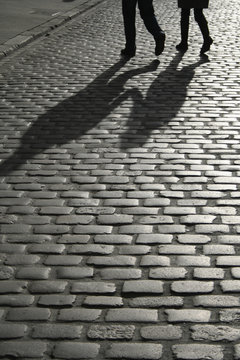 Pedestrian Crossing A Cobbled Street