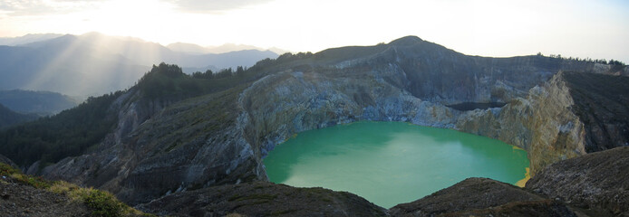 sunlight on the green crater lake, kelimutu volcano, flores, ind