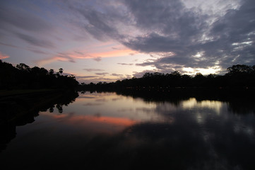 Naklejka premium moat of angkor wat at sunset