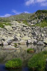 mountain landscape with little lake