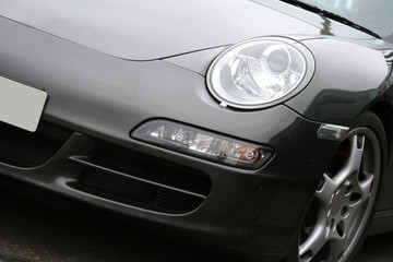 front of grey sportscar