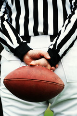 american football referee and ball