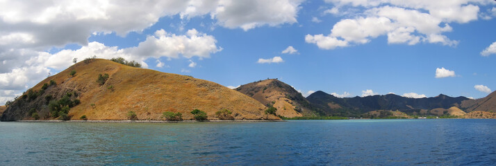 yellow mountains falling on the sea, komodo archipelago, indones