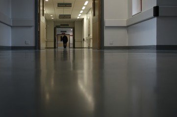 man walking along hospital corridor - 2764933