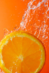 orange slice and water droplets