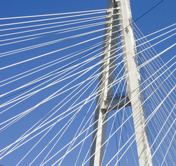 suspension bridge cables in blue sky
