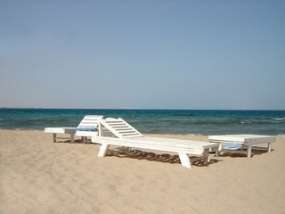 chaise longues on beach