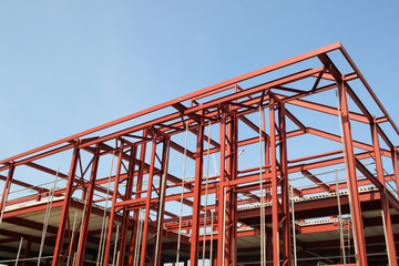 red steel building construction framework.