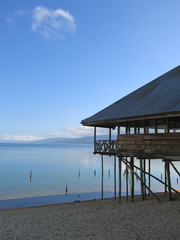 lake with clear water and a house with pile, poso lake, sulawesi