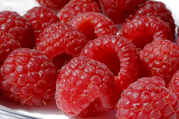 ripe raspberries in a pile
