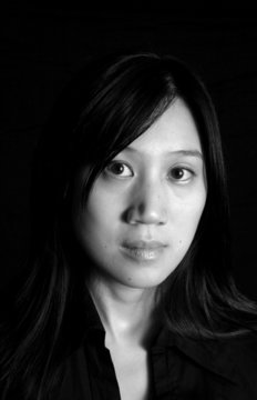 thoughtful chinese woman in black and white