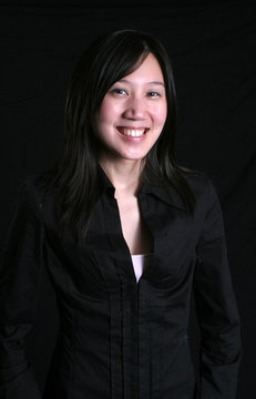 low key, chinese woman smiling