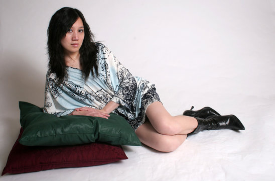 chinese woman with boots on pillows