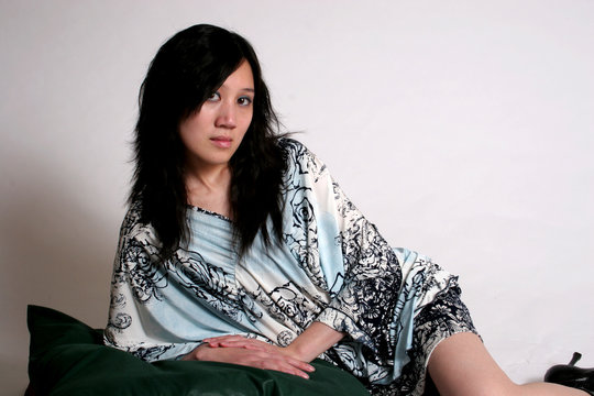 chinese woman recumbant on pillows