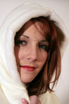 redhead woman in white hood