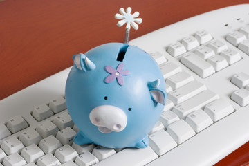 keyboard with a piggy bank