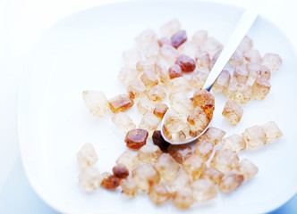 brown candy sugar and a teaspoon on the plate macr