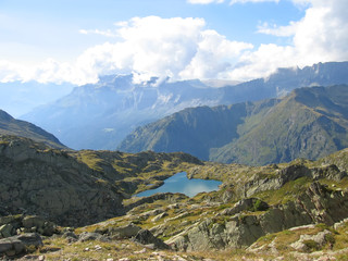 small lake with clouds reflection, aiguillette des houches, brev
