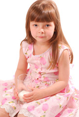 girl with milk-moustache holding glass of milk