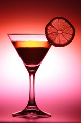 drink with lemon in red tone