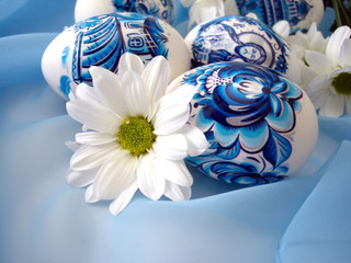 Fototapeta na wymiar beautiful blue easter eggs with white flower