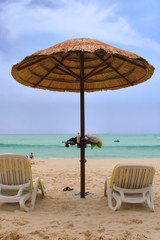  sunchairs and umbrella on the beach