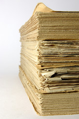 antique books piled front a silver background