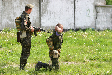 arrest (two soldiers during military exercise)
