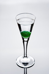 shot glass of vodka with cherry