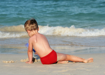 little boy on a tropical beach