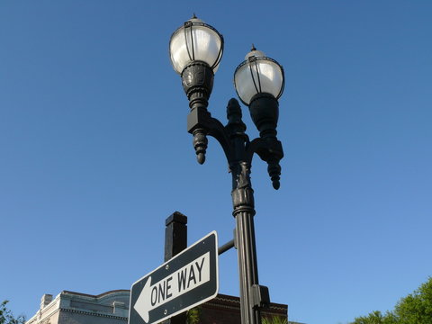 lamp posts and one way sign