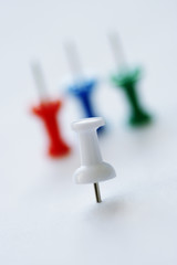 white pin and colored pins