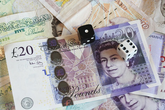 british bank notes with dice