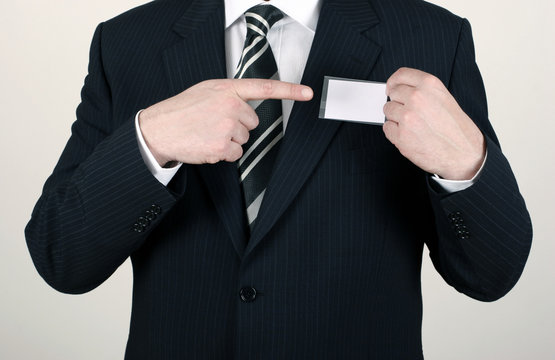 salesman pointing out his nametag
