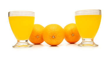 three oranges and orange juice isolated on white