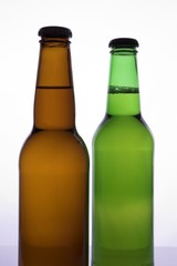 two beer bottles with no labels