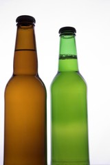 two beer bottles with no labels