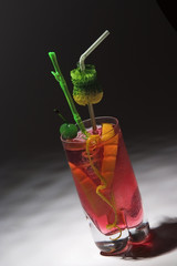 red drink with green cherry