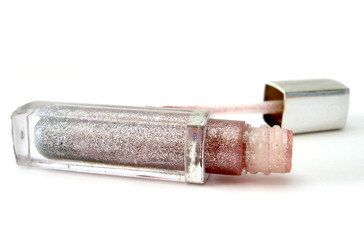 opened silver gloss for lips on white background