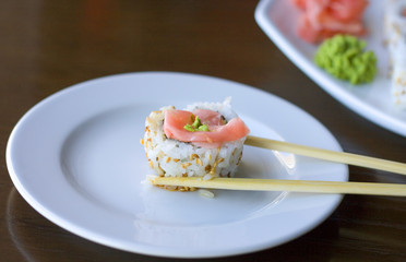 sushi roll between two sticks