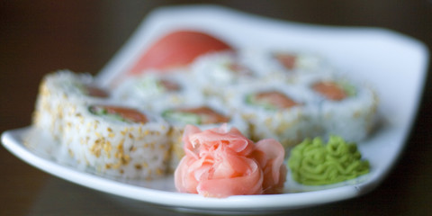 focus on ginger sushi roll and wasabi out of focus