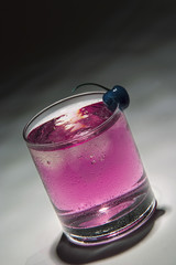 drink with blue cherry and ice
