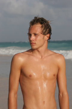 young athletic male on beach
