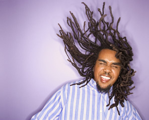 african-american man with his dreadlocks in motion.